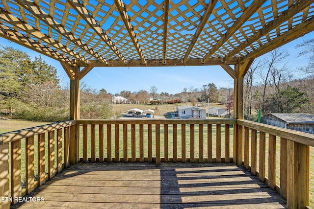 wooden deck featuring a yard