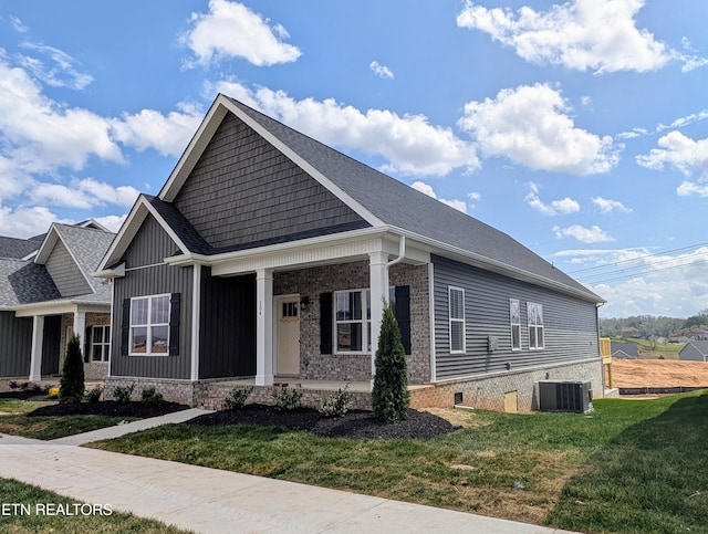 view of front facade featuring central AC unit, a front lawn, and a porch