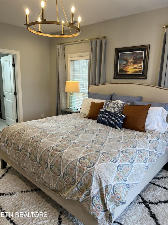 bedroom with an inviting chandelier