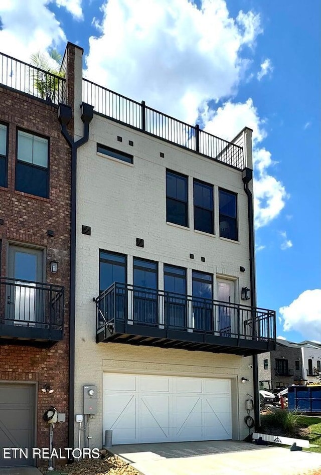 back of house with a garage