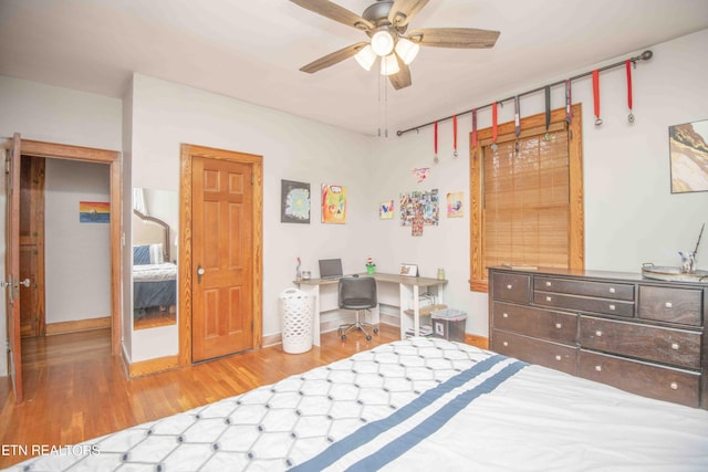 bedroom with hardwood / wood-style floors and ceiling fan