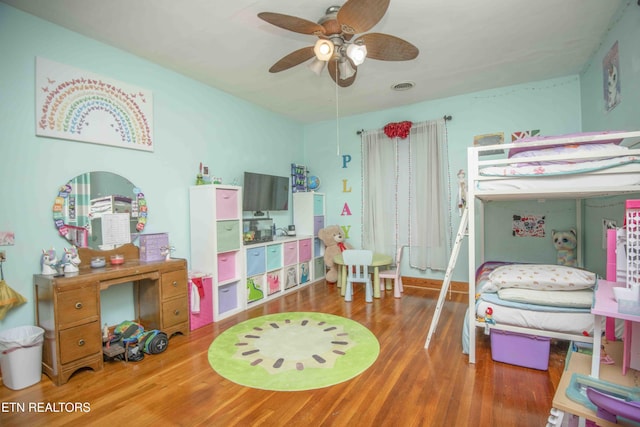 bedroom with ceiling fan and wood-type flooring