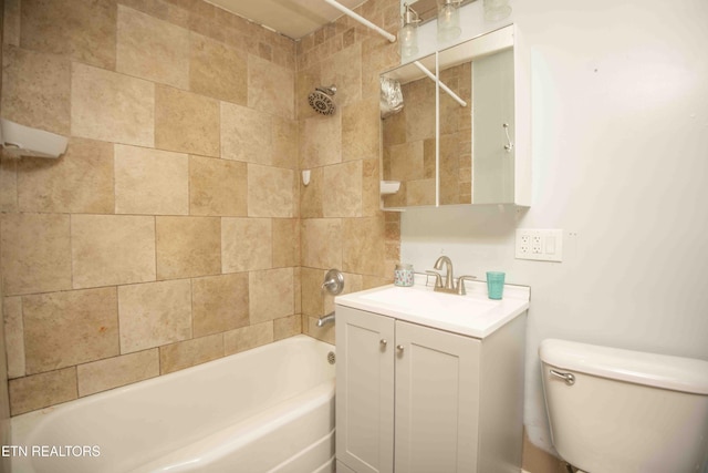 full bathroom featuring vanity, toilet, and tiled shower / bath