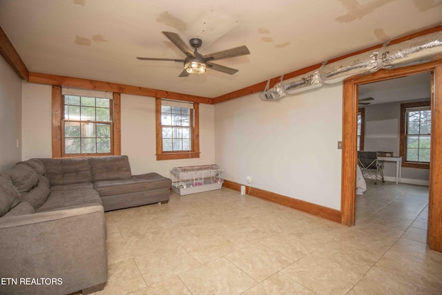 living room with ceiling fan and light tile patterned floors