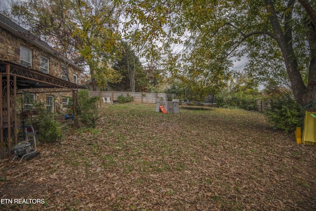 view of yard with a trampoline