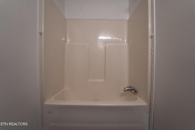 bathroom with shower / bathing tub combination