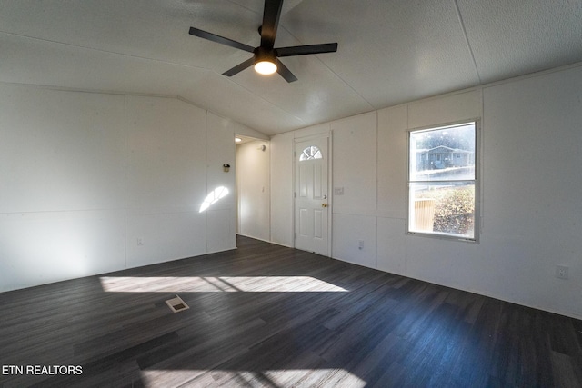 entrance foyer with ceiling fan, dark hardwood / wood-style floors, and lofted ceiling