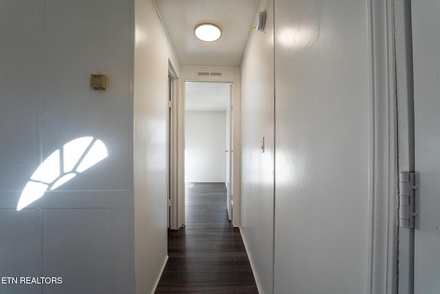 hallway featuring dark hardwood / wood-style floors