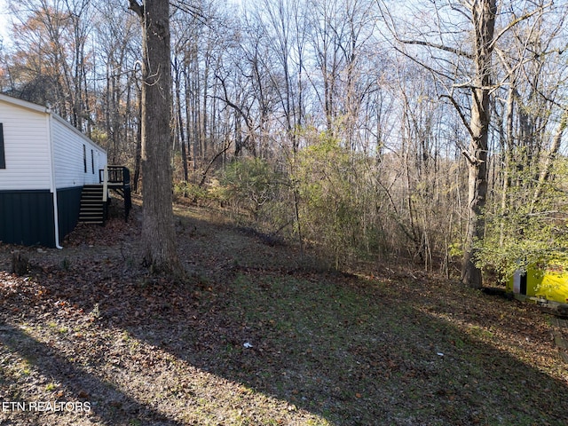 view of yard with a wooden deck