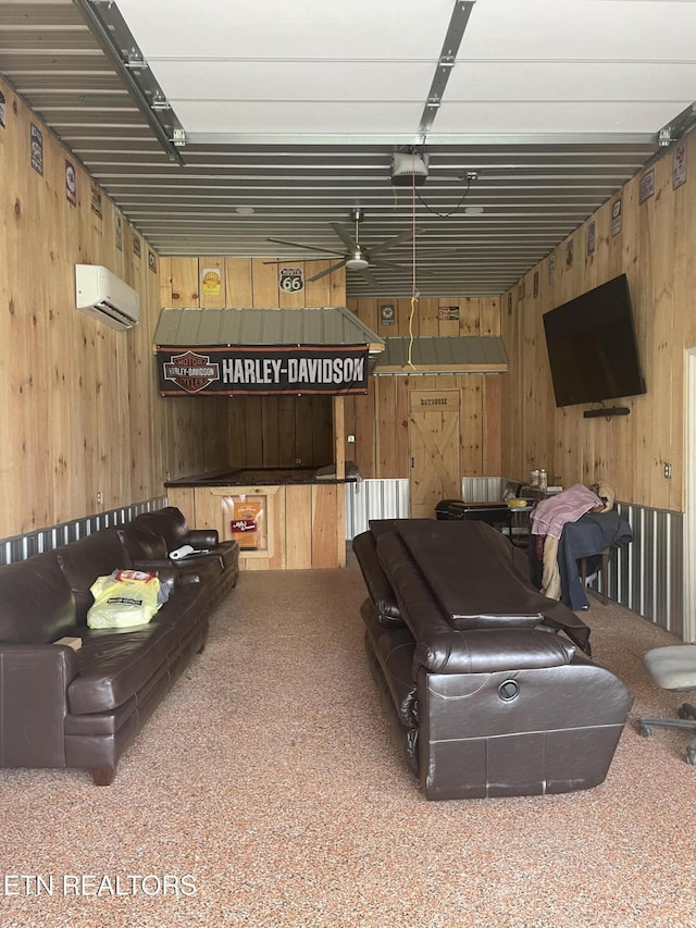 living room with a wall mounted AC and wood walls