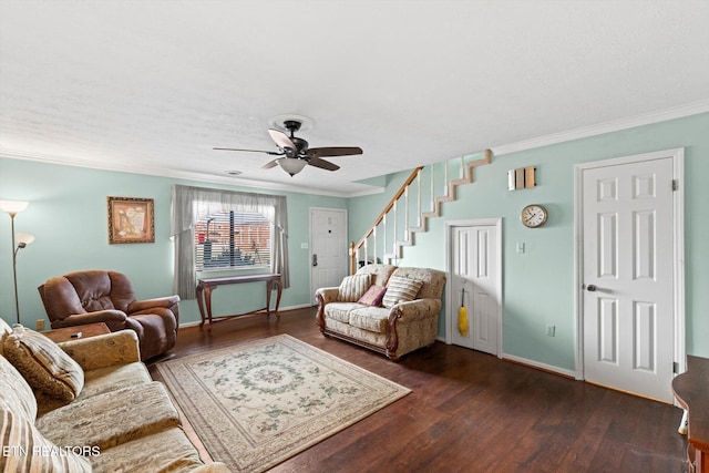 living room featuring dark hardwood / wood-style floors, ceiling fan, and crown molding