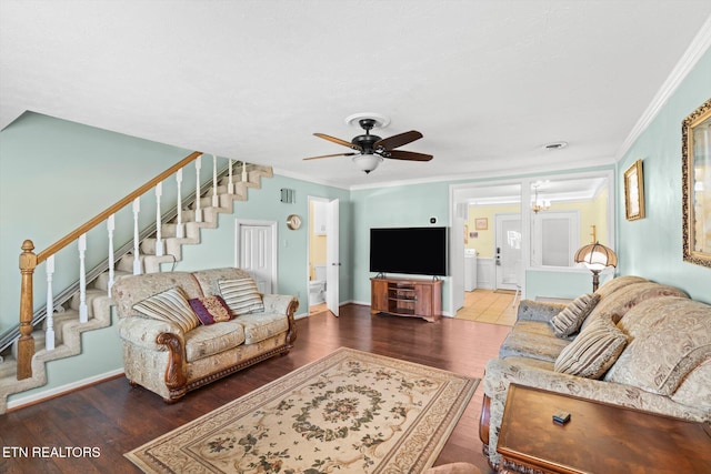 living room featuring washer / dryer, crown molding, ceiling fan, and hardwood / wood-style flooring