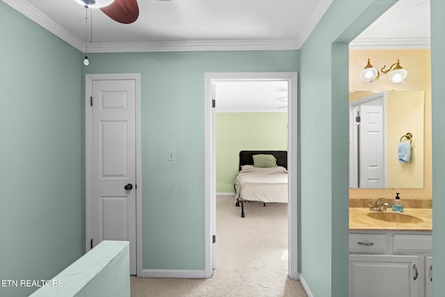 bathroom featuring vanity, ceiling fan, and ornamental molding