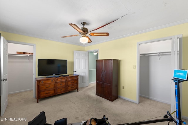 bedroom with ceiling fan, light colored carpet, and crown molding