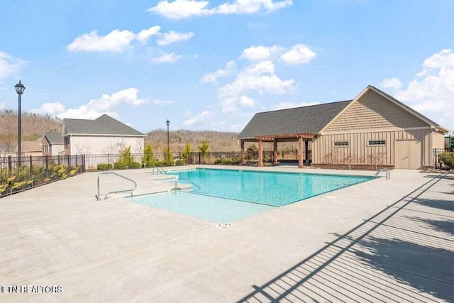 view of swimming pool featuring a patio