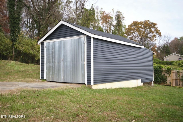 view of outdoor structure with a lawn