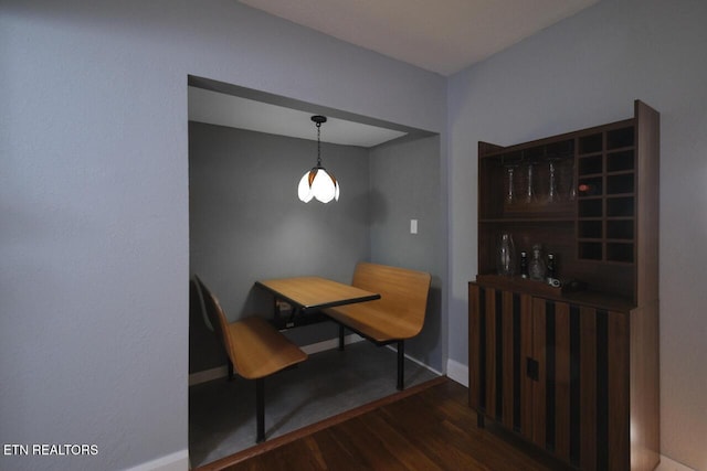 dining space featuring dark hardwood / wood-style floors