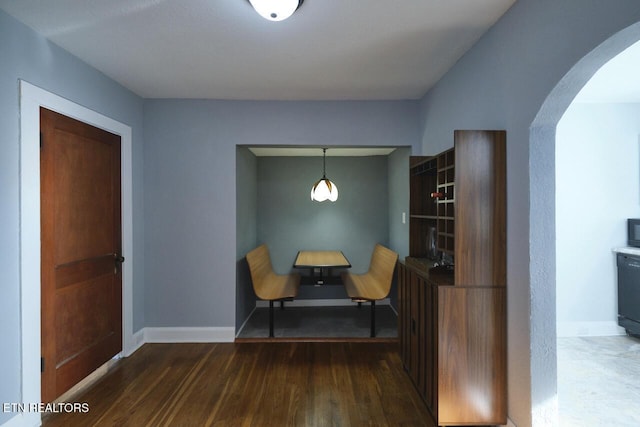 sitting room with dark hardwood / wood-style floors