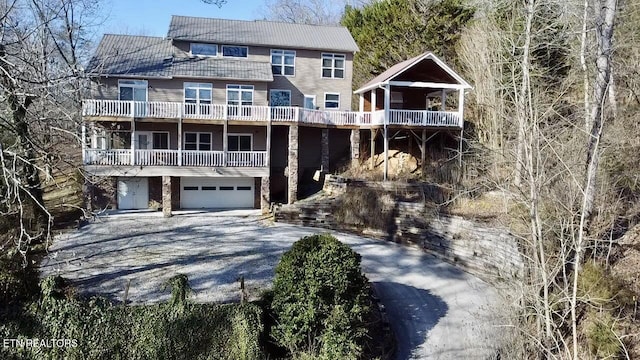 view of front facade with a balcony and a garage