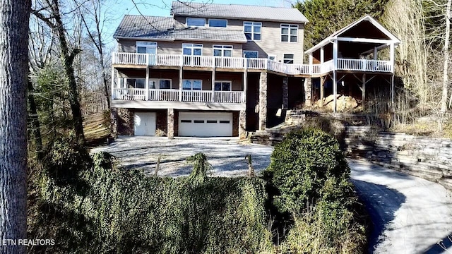 view of front of house with a garage and a balcony