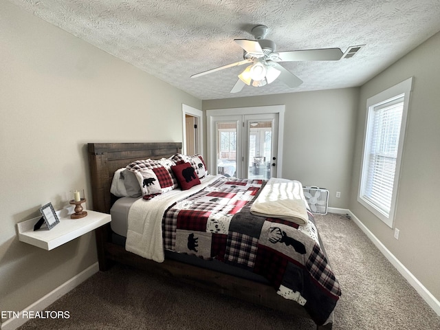 carpeted bedroom featuring ceiling fan, access to outside, french doors, and a textured ceiling