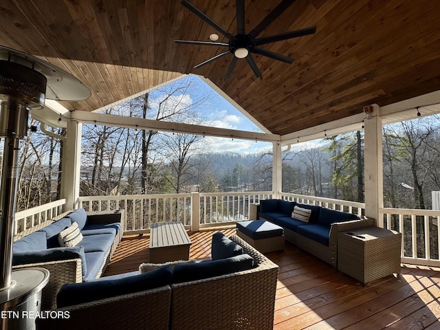 wooden terrace featuring ceiling fan and outdoor lounge area