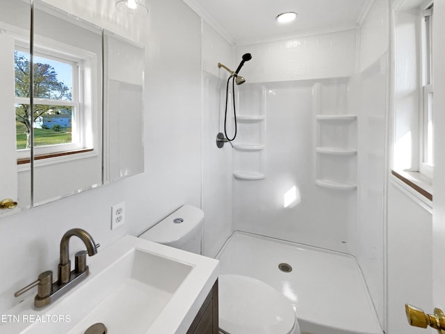 bathroom with toilet, walk in shower, ornamental molding, and sink