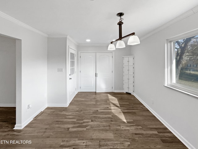 unfurnished dining area with ornamental molding and dark wood-type flooring