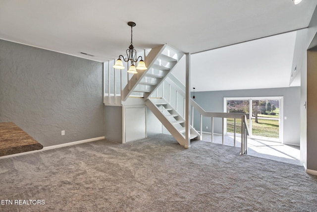 unfurnished living room featuring carpet flooring and an inviting chandelier