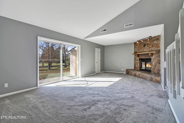 unfurnished living room featuring a fireplace, carpet floors, and high vaulted ceiling