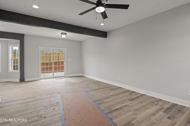 empty room featuring baseboards, ceiling fan, beam ceiling, recessed lighting, and light wood-style floors