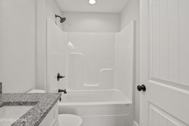 bathroom with toilet, bathtub / shower combination, and vanity