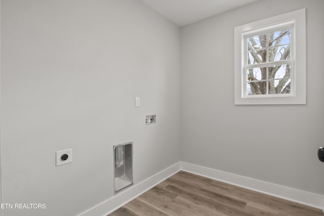 laundry area with wood finished floors, baseboards, hookup for an electric dryer, laundry area, and washer hookup