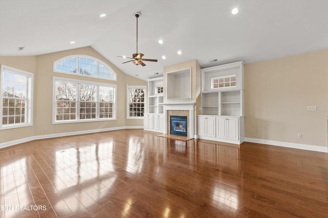 unfurnished living room with hardwood / wood-style floors, ceiling fan, and lofted ceiling