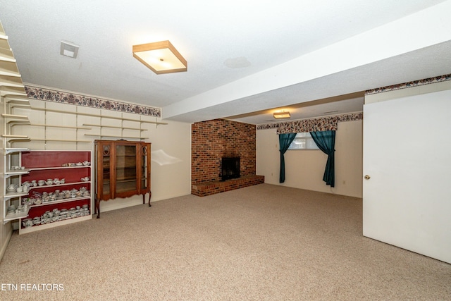 basement with carpet floors and a brick fireplace