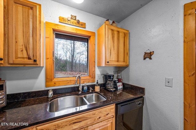 kitchen with a textured ceiling, sink, black dishwasher, and dark stone counters