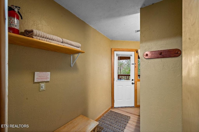 doorway to outside with light hardwood / wood-style flooring