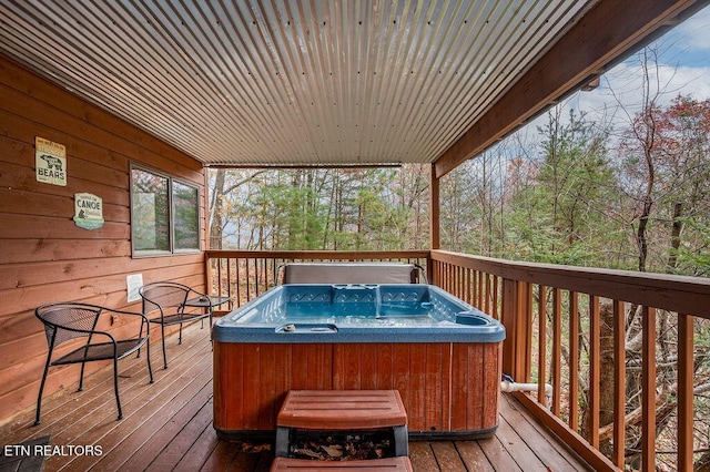 deck with a hot tub