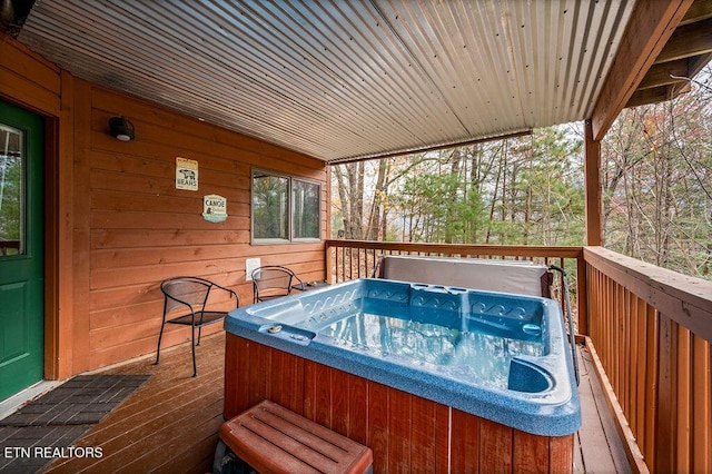 deck featuring a hot tub