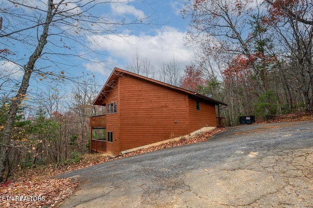 view of side of property featuring a balcony