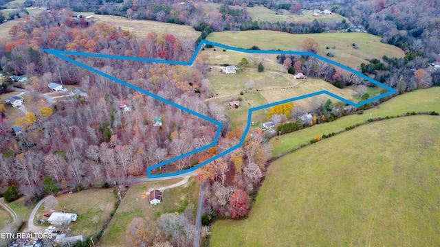 birds eye view of property featuring a rural view