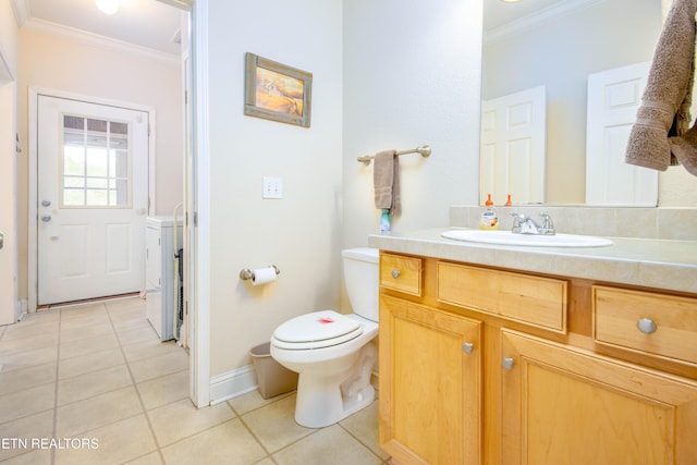 bathroom with tile patterned flooring, crown molding, vanity, and toilet