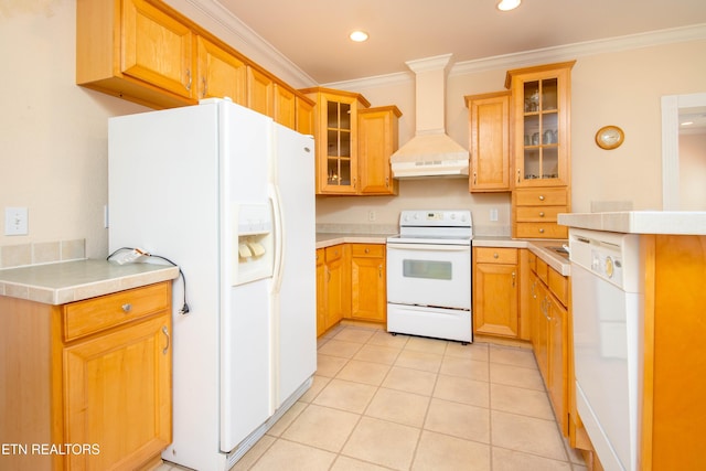 kitchen featuring white appliances, ornamental molding, custom exhaust hood, light countertops, and light tile patterned flooring