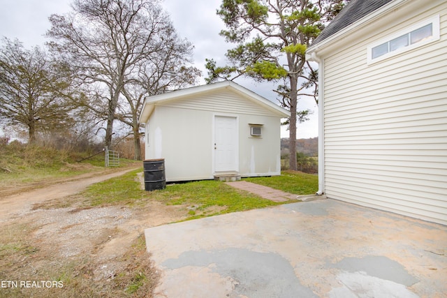 view of outbuilding with an outbuilding and driveway