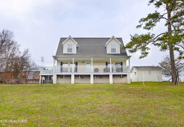 view of front of home featuring a front yard and fence