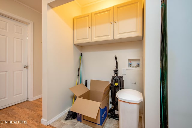 bathroom featuring wood finished floors and baseboards