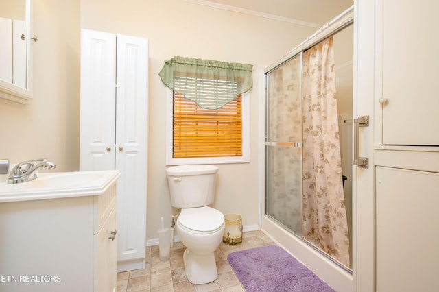 bathroom with toilet, tile patterned floors, a shower stall, and vanity