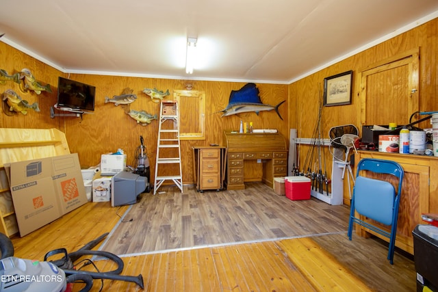 interior space featuring ornamental molding and wood finished floors