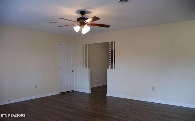 spare room featuring ceiling fan, dark hardwood / wood-style flooring, and a textured ceiling