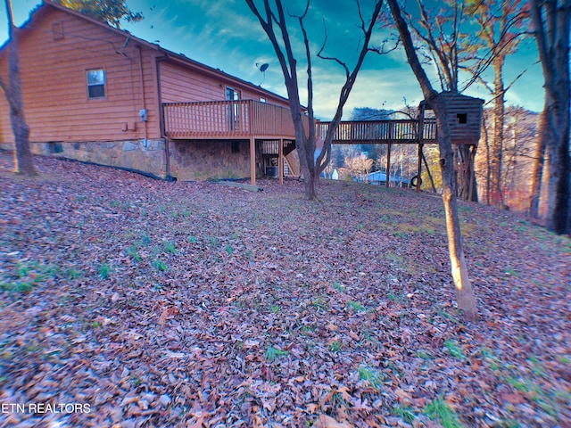 view of yard with a wooden deck